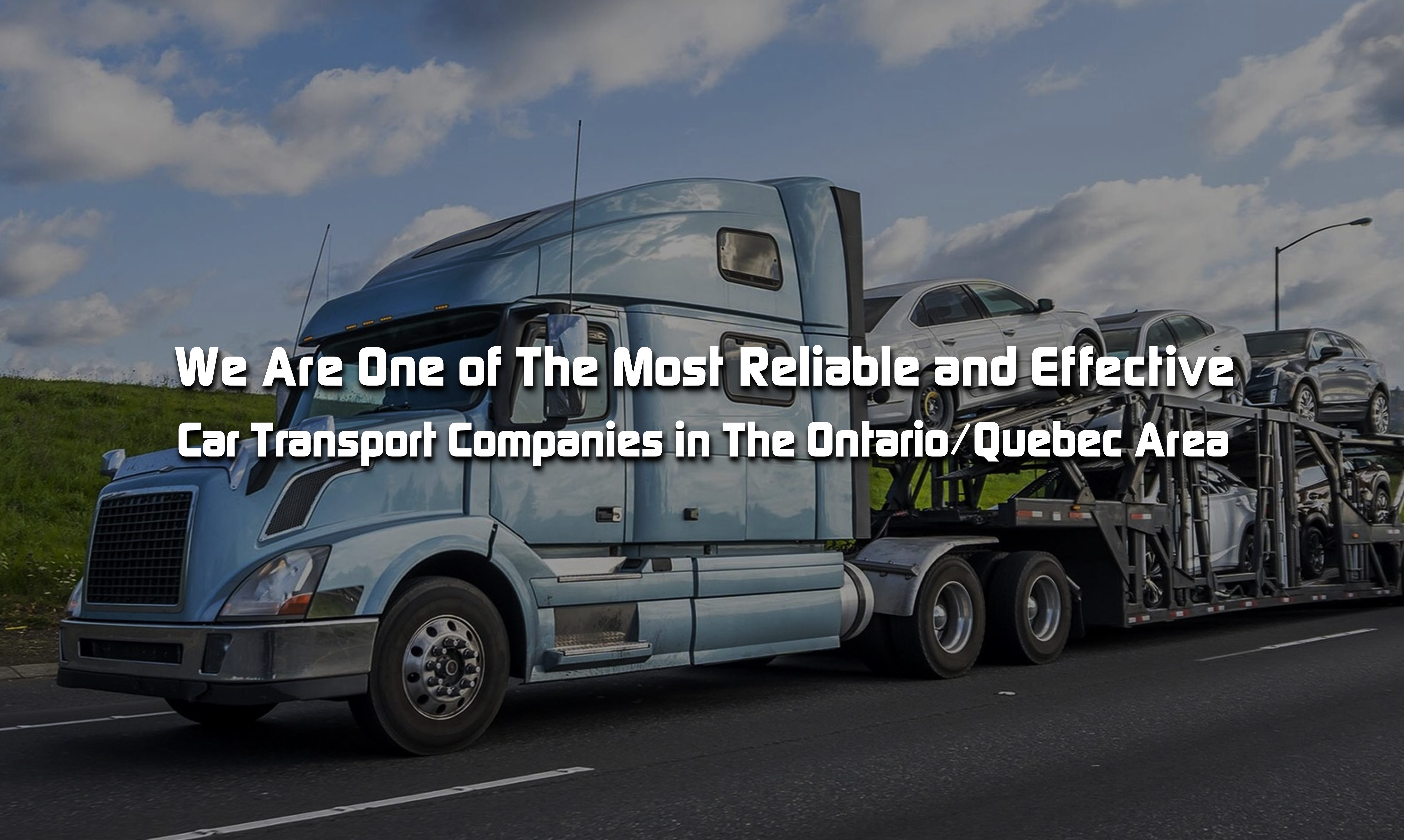 A loaded auto transport carrier on the road.
